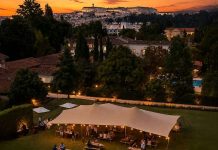 Quinta das Lágrimas assinala 700 anos com Harvest Party dedicada à vindima Quinta das Lágrimas e jardins com Coimbra ao fundo ao entardecer